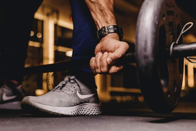 It is image of a weight lifter doing his thing as a weight lifter