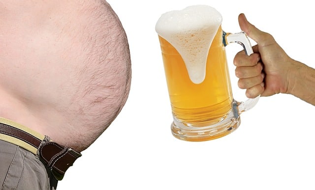 A man with big stomach facing a cup of bear